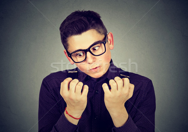 man looking at hands nails obsessing about cleanliness germs  Stock photo © ichiosea
