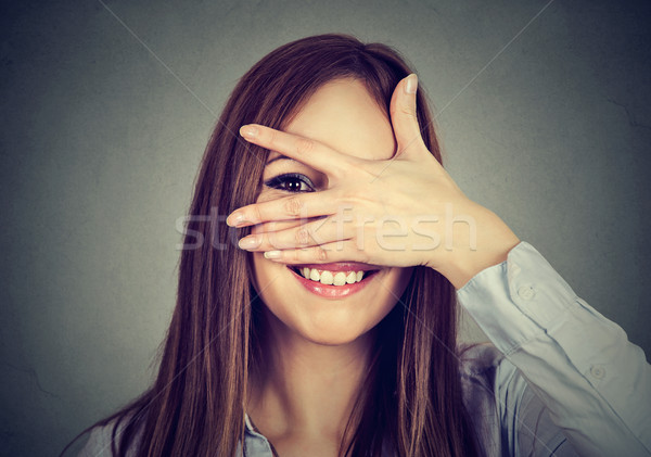 Happy woman peeping at you laughing  Stock photo © ichiosea