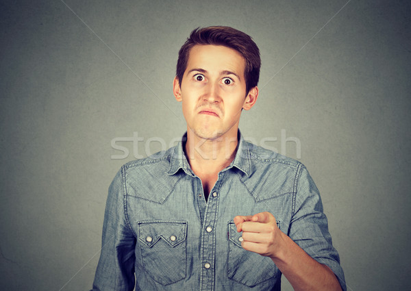 angry man pointing his finger accusing someone  Stock photo © ichiosea