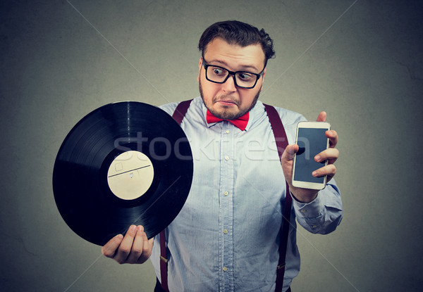 Man confused with new and old technology Stock photo © ichiosea