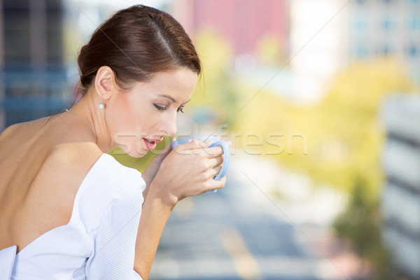 Stock photo: Beautiful woman enjoying her weekend on a balcony of her apartment