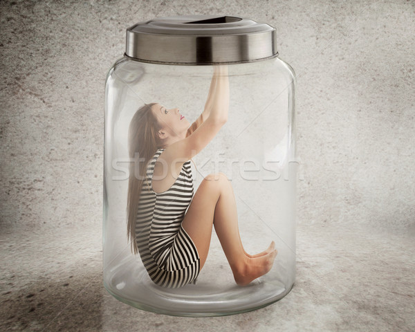 Giovani solitaria donna seduta vetro jar Foto d'archivio © ichiosea