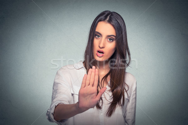annoyed angry woman with bad attitude giving talk to hand gesture Stock photo © ichiosea