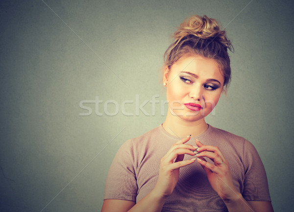Sinsi genç kadın bir şey negatif insan duygular Stok fotoğraf © ichiosea
