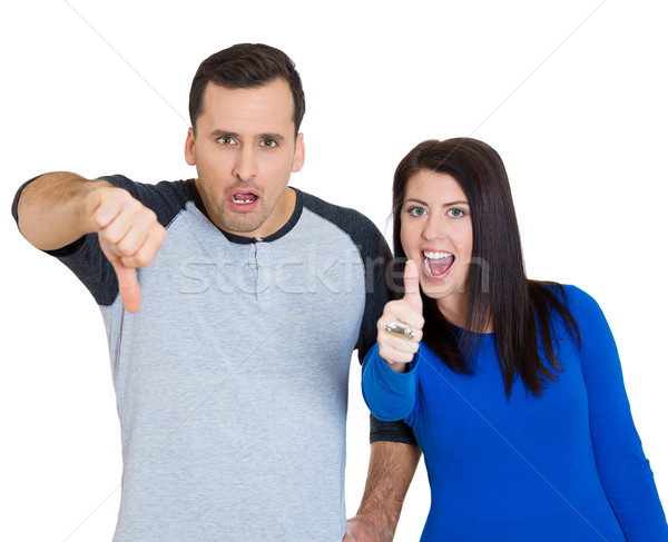 man showing thumbs down and woman thumbs up Stock photo © ichiosea
