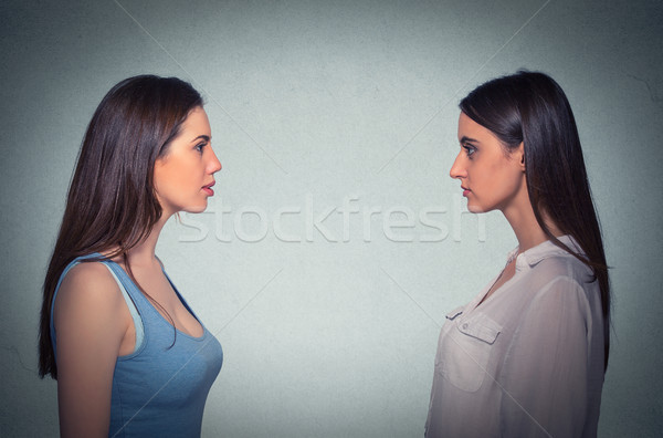 Side profile two young women looking at each other  Stock photo © ichiosea