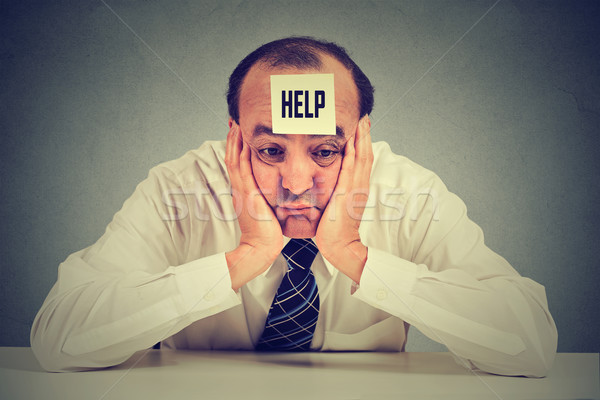 Tired, stressed middle aged employee needs help Stock photo © ichiosea