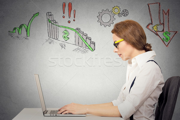 Stock photo: Woman working on computer, anticipation of financial crisis