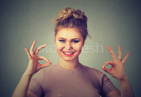 Excited happy young optimistic woman giving ok sign gesture with two hands  Stock photo © ichiosea