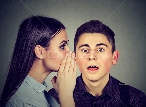 Latest rumors. Amazed man listening gossip in the ear  Stock photo © ichiosea
