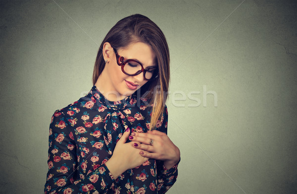 Closeup portrait young woman with breast pain touching chest  Stock photo © ichiosea