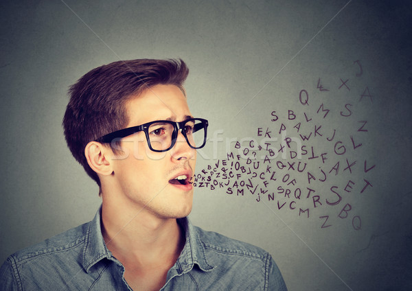 Man talking with alphabet letters coming out of his mouth Stock photo © ichiosea