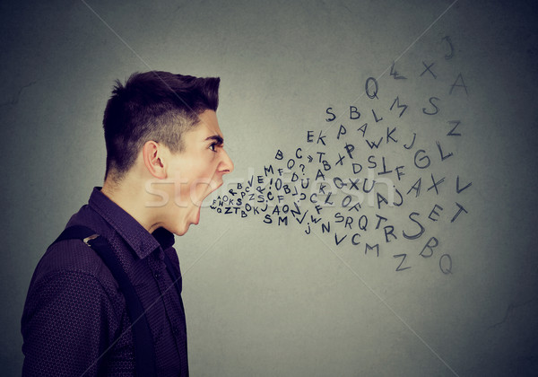 Angry man screaming alphabet letters coming out of mouth  Stock photo © ichiosea