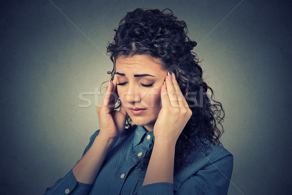 sad young woman with worried stressed face expression having headache  Stock photo © ichiosea