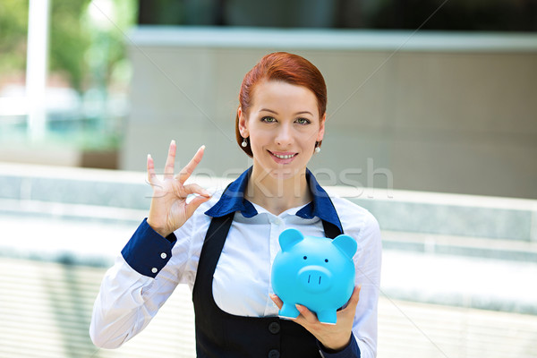 Happy woman, corporate employee holding piggy bank Stock photo © ichiosea