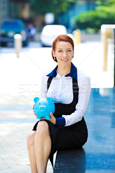 Glücklich Frau Corporate Mitarbeiter halten Sparschwein Stock foto © ichiosea