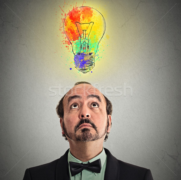 businessman came up with solution answer for problem lightbulb above head Stock photo © ichiosea