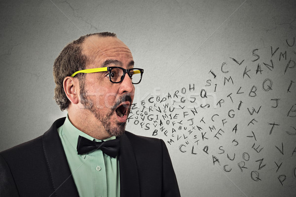man talking with alphabet letters coming out of open mouth Stock photo © ichiosea