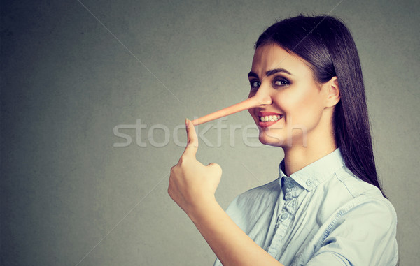 Stock photo: Happy liar woman with long nose 