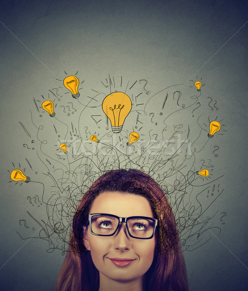 Mujer gafas muchos ideas bombillas Foto stock © ichiosea