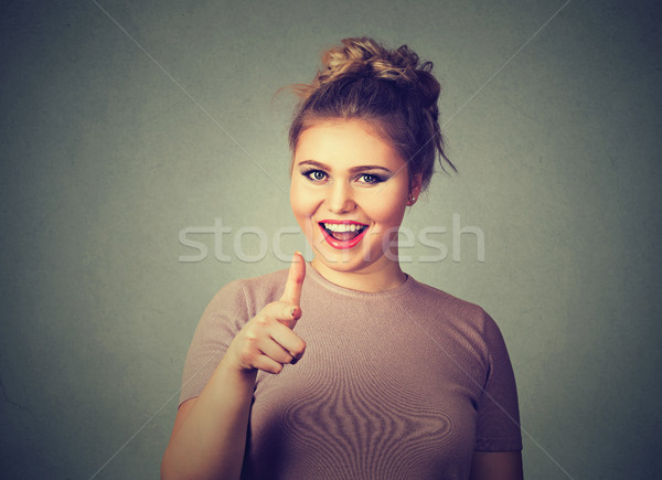 smiling woman pointing finger at viewer camera gesture  Stock photo © ichiosea