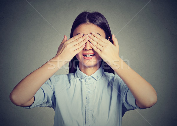 Laughing woman covering eyes with hands  Stock photo © ichiosea