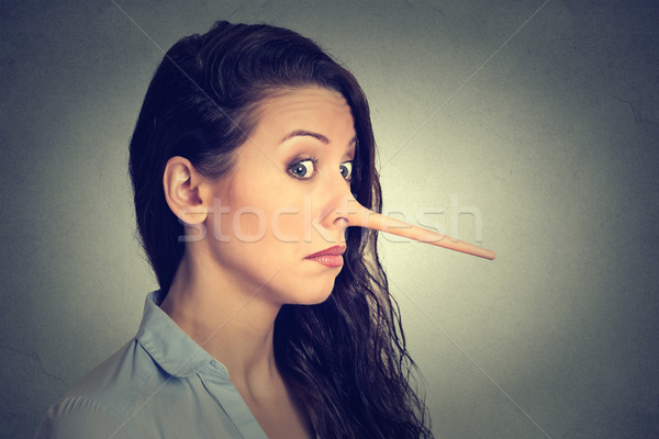 Vrouw lang neus leugenaar geïsoleerd grijs Stockfoto © ichiosea