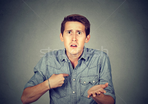 Angry, mad man pointing at himself asking you mean me? Stock photo © ichiosea
