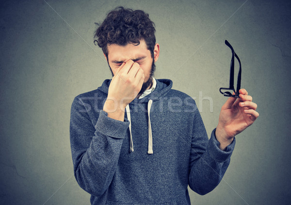 Hombre gafas sufrimiento joven triste lectura Foto stock © ichiosea