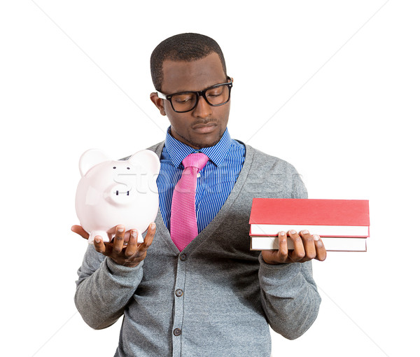 Man holding books and piggy bank Stock photo © ichiosea