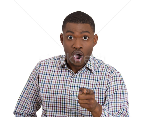 Stock photo: a shoucked dumbstruck guy pointing at the camera