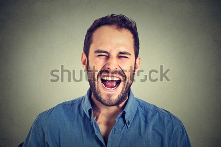 Boos jonge man schreeuwen achtergrond portret pijn Stockfoto © ichiosea