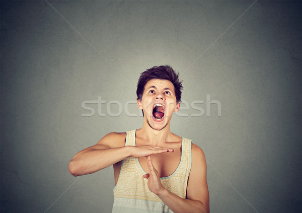 man showing time out hand gesture frustrated screaming Stock photo © ichiosea