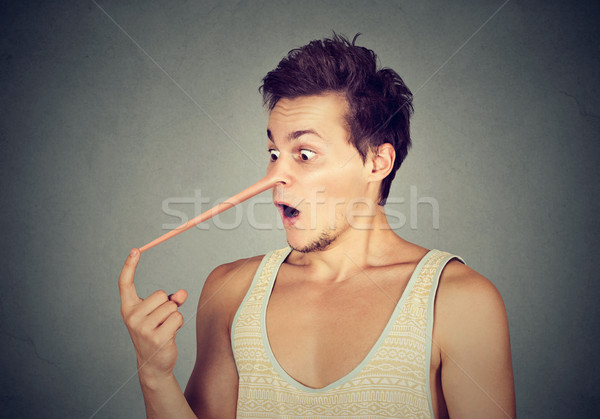 Man with long nose. Liar concept.  Stock photo © ichiosea