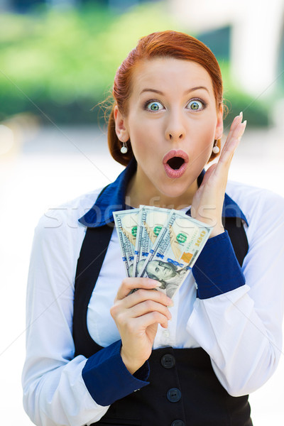 Excited woman holding dollar bills Stock photo © ichiosea