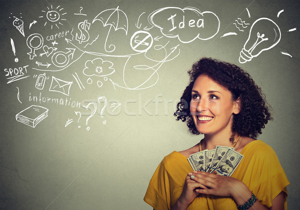excited successful young business woman holding money dollar bills in hand Stock photo © ichiosea