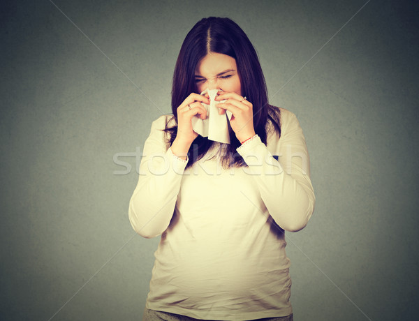 pregnant woman sneezing having cold blowing runny nose Stock photo © ichiosea