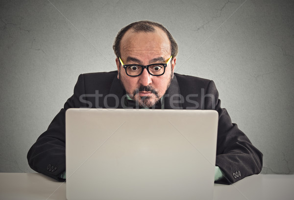 man looking concentrated on computer screen  Stock photo © ichiosea