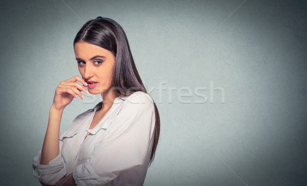 sneaky, sly, scheming young woman plotting something Stock photo © ichiosea