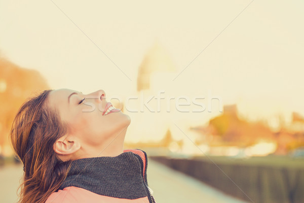 Side profile woman smiling looking up to sky enjoying freedom  Stock photo © ichiosea