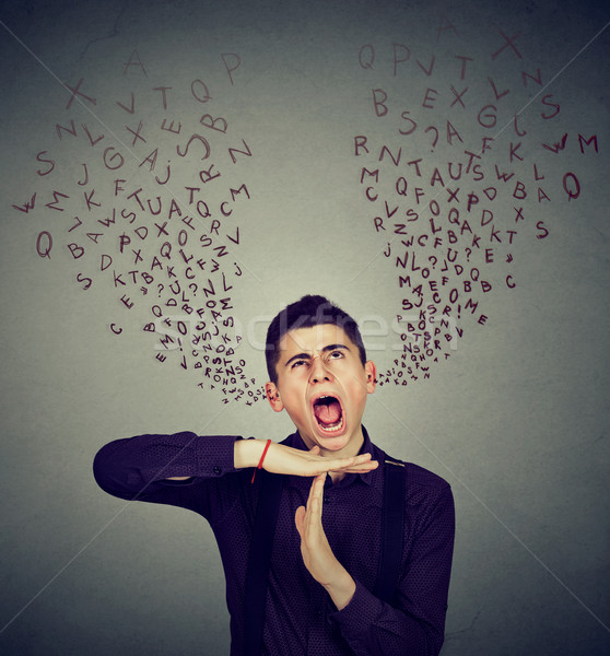 Man showing time out gesture screaming alphabet letters coming out of mouth Stock photo © ichiosea