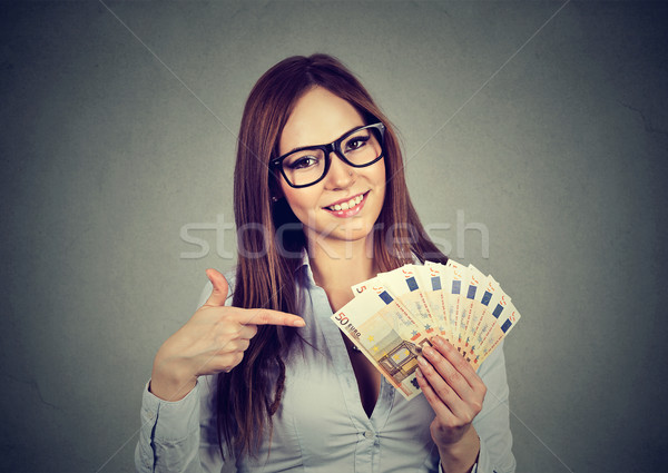 Happy successful business woman holding money euro bills in hand  Stock photo © ichiosea