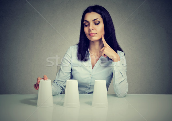 Thoughtful woman playing a conjuring trick game  Stock photo © ichiosea