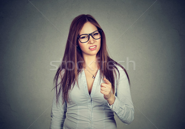 Upset annoyed woman pointing finger at camera  Stock photo © ichiosea