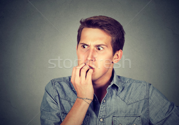 Anxious stressed young man looking away Stock photo © ichiosea