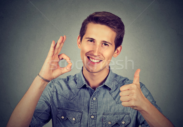 Stock photo: Enthusiast man with thumbs up ok hand gesture 