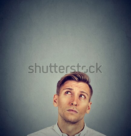 Headshot confused man thinking looking up Stock photo © ichiosea