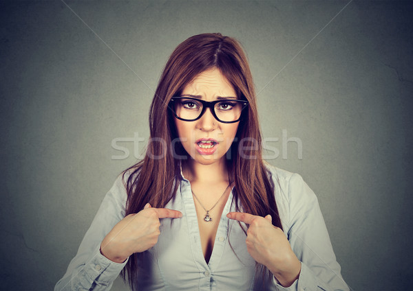 Stock photo: Portrait of angry annoyed woman asking you talking to me, you mean me? 