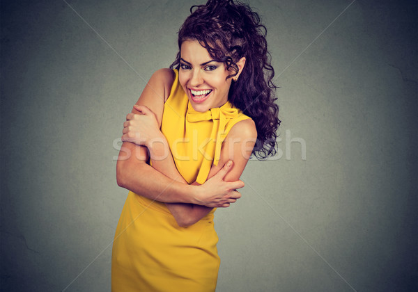 Smiling woman holding hugging herself. Love yourself concept Stock photo © ichiosea