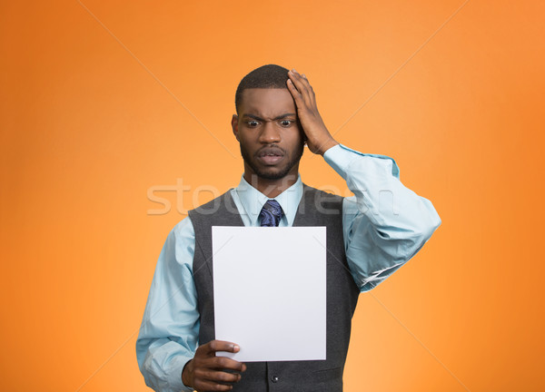 Man holding paper, statement, shocked with bad news Stock photo © ichiosea